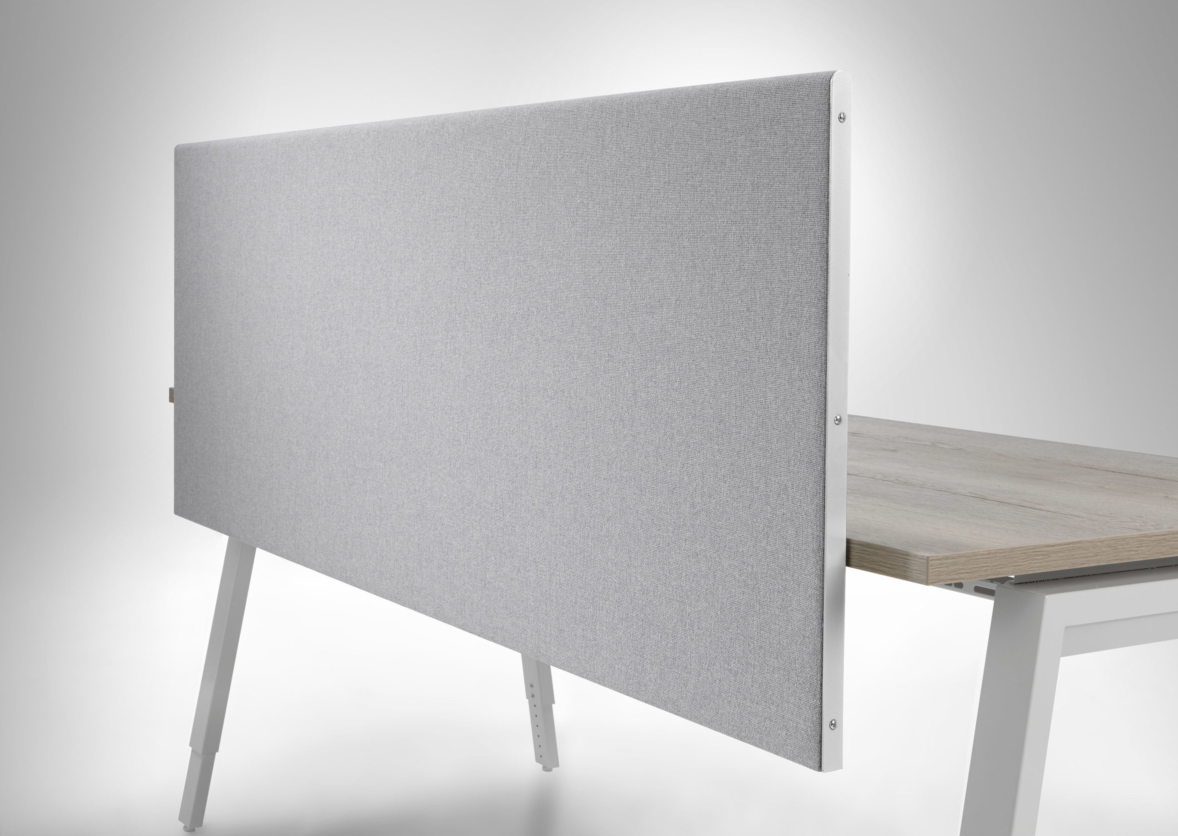 Cara acoustic fabric in 'Glass' colour applied to desk screen
